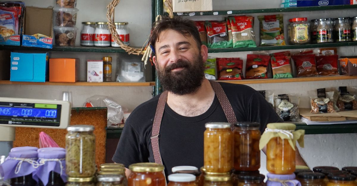 A small local business owner greeting a customer in their shop