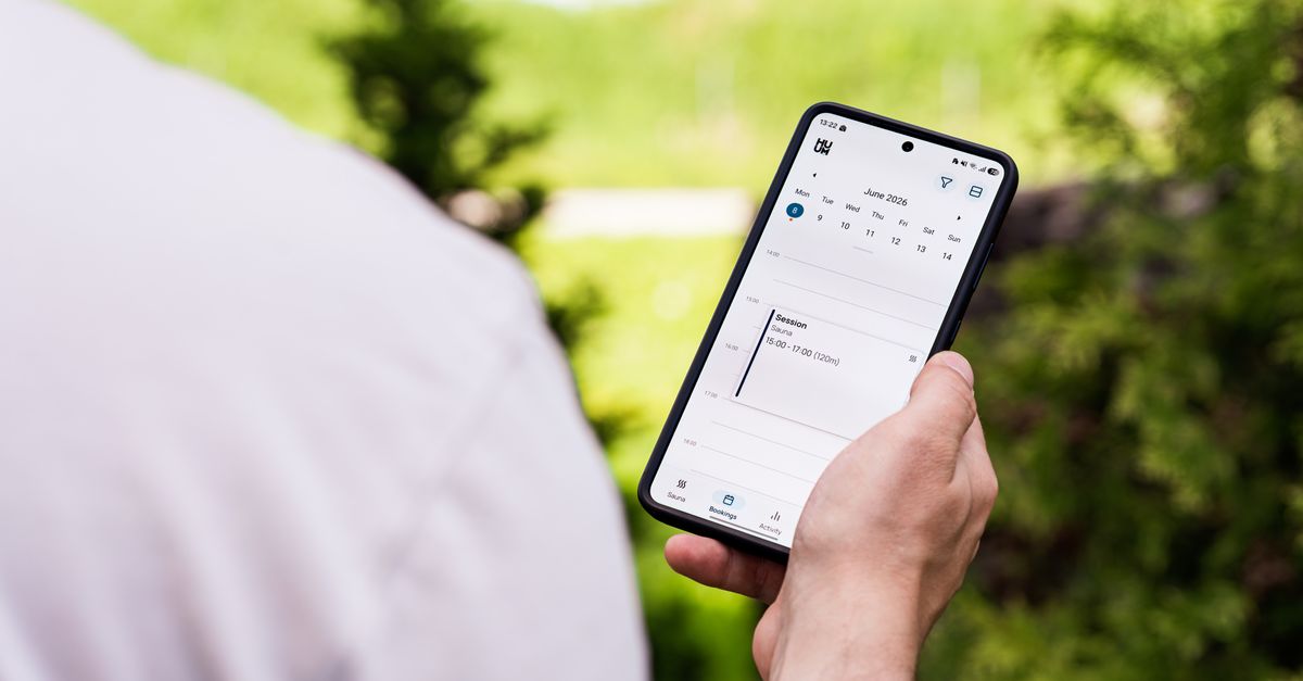 A small business owner managing appointments on a phone and calendar